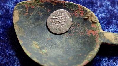 A 17th century Arabian silver coin that research shows was struck in 1693 in Yemen. The coin was found in 2014 by metal detectorist Jim Bailey, who says it was plundered in 1695 by English pirate Henry Every from Muslim pilgrims sailing home to India. AP