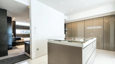 The main bedroom has its own walk-in dressing room