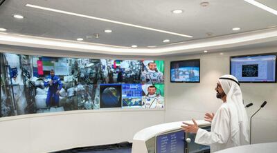 Sheikh Mohamed Bin Rashid talks with Emirati astronaut, Hazza Al Mansouri, during a live satellite feed from the International Space Station. Courtesy Dubai Media Office