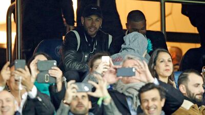 Paris Saint Germain's injured Brazilian forward Neymar watches from the stands at the Parc des Princes. EPA
