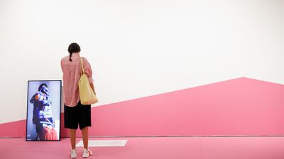 A visitor at a gallery inside Alserkal Avenue, which recently reopened following weeks of closure. Courtesy Alserkal Avenue