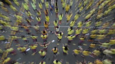Filipinos follow steps during a Zumba class as they attempt to break a Guinness world record in suburban Mandaluyong, east of Manila, Philippines on Sunday, July 19, 2015. Guinness representative Alan Pixley announced that Mandaluyong city in the Philippines now holds the new world record for the title largest Zumba class with a total participant of 12,975. Aaron Favila / AP photo