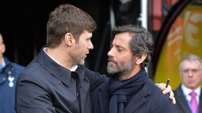 Tottenham Hotspur's Argentinian Head Coach Mauricio Pochettino (L) greets Watford's Spanish manager Quique Sanchez Flores ahead of the English Premier League football match between Watford and Tottenham Hotspur at Vicarage Road Stadium in Watford, north of London on December 28, 2015. AFP PHOTO / OLLY GREENWOODRESTRICTED TO EDITORIAL USE. NO USE WITH UNAUTHORIZED AUDIO, VIDEO, DATA, FIXTURE LISTS, CLUB/LEAGUE LOGOS OR 'LIVE' SERVICES. ONLINE IN-MATCH USE LIMITED TO 75 IMAGES, NO VIDEO EMULATION. NO USE IN BETTING, GAMES OR SINGLE CLUB/LEAGUE/PLAYER PUBLICATIONS.
