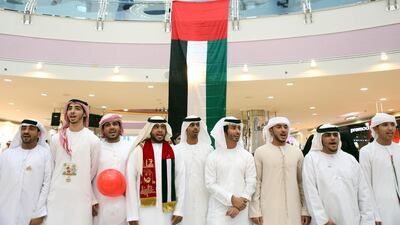 A group of 30 Emirati volunteers took initiative yesterday when they organised a grassroots National Day event at Marina Mall. Sammy Dallal / The National