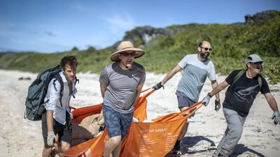 From left: Johnny Briggs, Brett Howell, James Beard and Robin Shackell clearing rubbish from the beach. Iain McGregor/STUFF