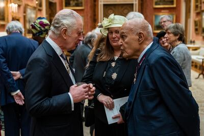 King Charles III talks with Sir Magdi at Buckingham Palace. Getty