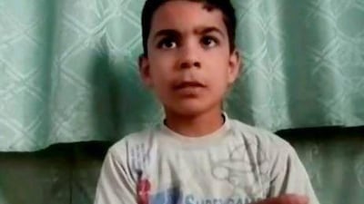 This image made from amateur video, purports Ali Al Sayed, 11, who survived the Houla massacre by pretending to be dead. Shaam News Network via AP video / AP Photo