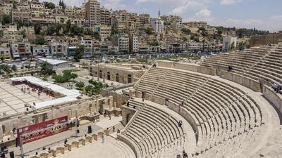 Roman amphitheatre in downtown with Amman cityscape at background. IMF says international donor support for Jordan crucial to preserve economic stability.