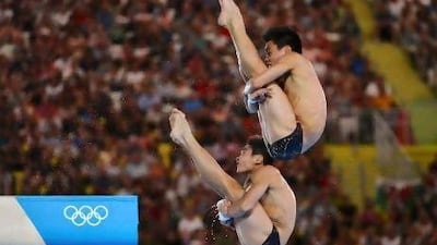 China's Cao Yuan, left, and Zhang Yanquan won gold in the men's synchronised 10m platform final. Toby Melville / AFP