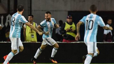 Nicolas Otamendi, centre, celebrates after scoring Argentina's late equaliser against Venezuela. Juan Barreto / AFP
