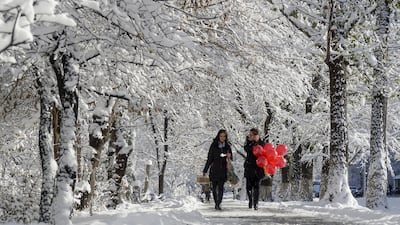 Women walk along a snow-covered alley in Almaty, Kazakhstan, on November 16, 2015. Shamil Zhumatov / Reuters