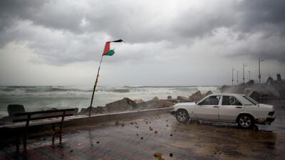 A Palestinian family sits inside their car. AP Photo