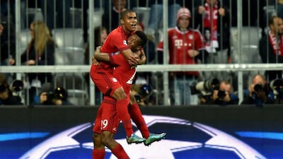 Bayern Munich's Douglas Costa, top and Kingsley Coman celebrate a goal during the team's Champions League win over Dinamo Zagreb last week. Peter Kneffel / EPA / September 29, 2015