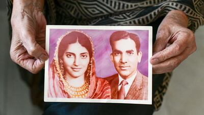 Dr Rafeeya Sultan Pasha shows a photograph of her with husband with Mohammed Sultan Pasha on their wedding day in Karachi. Khushnum Bhandari / The National