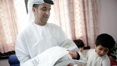 AbdelRahman Al Zaabi, welcomes the birth of his fourth son Rashed, as his other sons Mohammed, 5, and Saif, 7, look on at the Corniche Hospital. Rashed was the first baby born there on Eid Al Fitr.