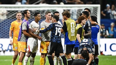 England's Jude Bellingham and Argentina's Nicolas Otamendi clash at the end of the World Cup semi-final. Reuters