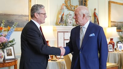 King Charles welcomes Mr Starmer during an audience at Buckingham Palace, where the monarch invited the leader of the Labour Party to become Britain's prime minister and form a new government