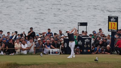 Viktor Hovland hits his tee shot on the 12th. Reuters