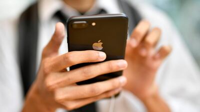 A young man looks at Apple's new iPhone 8 Plus at the Apple Store of Omotesando shopping district in Tokyo, Japan. Franck Robichon / EPA