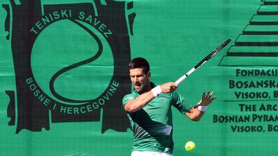 Serbian tennis player Novak Djokovic returns the ball during an exhibition match, organised to mark the opening of a tennis court at the "Archaeological park of the Bosnian pyramid" near Visoko, north of Sarajevo. AFP