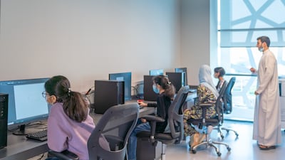 Pupils from Sharjah schools learning about programming and applications development.