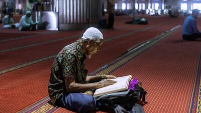 A man sits reading inside the Istiqlal Mosque in Jakarta. Bloomberg