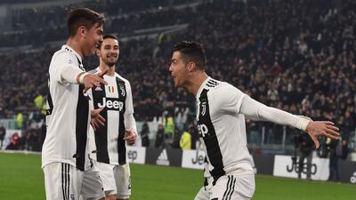Juventus' Cristiano Ronaldo celebrates with teammate Paulo Dybala after scoring his team's third goal. Getty Images
