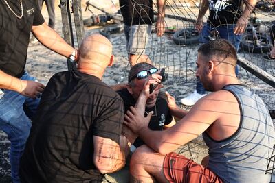 Villagers near the site where a projectile hit a playground in Majdal Shams. EPA