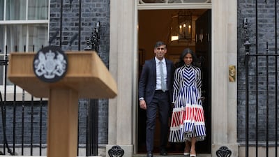 The couple step out into Downing Street. AP