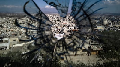 The city of Jenin in the occupied West Bank, seen through a bullet hole as the Isarel-Gaza war rages on. AFP