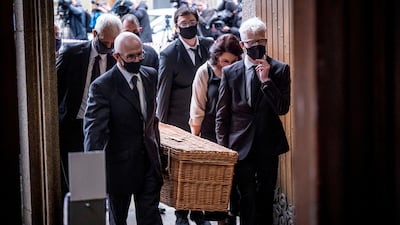 Members of the family carry the coffin of John Hume into St Eugene's Cathedral. AP Photo