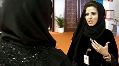 :Fatima Al Muhairi, an analyst for Etisalat and a shining example of the Millennial generation, with a visitor at Careers UAE 2012 yesterday.