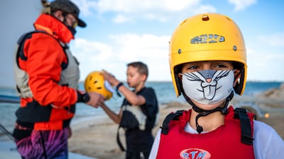 Pupils put on their safety gear before taking to the water.