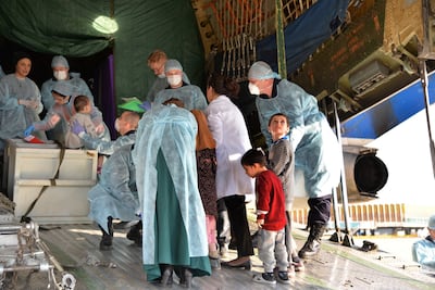 Children of suspected ISIS terrorists are checked by medical teams as they board a Russian plane at the runway of Baghdad International Airport in Baghdad, Iraq, on December 30, 2018. EPA