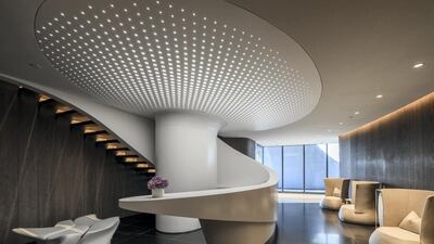 Curved structural elements, furniture and walls reflect Hadid's signature design style.