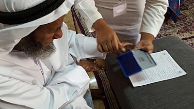 An elderly voter is registered at his home ahead of the Sharjah Consultative Council elections. Courtesy Hamriyah elections committee