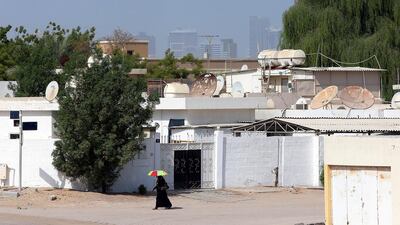 The streets in Samnan seem quiet during the day but residents say that is not the case at night when groups of workers gather to chat, socialise or play cricket. Satish Kumar / The National