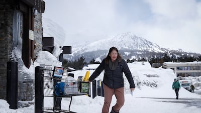 A shopper struggles to pull a cart outside Vons supermarket in Mammoth Lakes. EPA