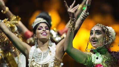 A dazzling, Bollywood-style show with dancers warmed up the crowd before Mr Modi appeared. Lucas Jackson / Reuters