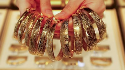 Gold jewellery on display in Lianyun District, China. A weaker US dollar makes gold more affordable for holders of other currencies. AFP
