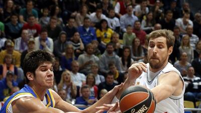 Andres Nocioni, right, of Real Madrid in action against Marko Todorovic of BC Khimki during their Euroleague match on Friday night. Maxim Shipenkov / EPA