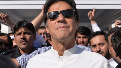 Pakistan opposition leader and head of the Pakistan Tehreek-e-Insaf political party Imran Khan leaves Parliament after attending a session in Islamabad on May 23. Aamir Qureshi / AFP