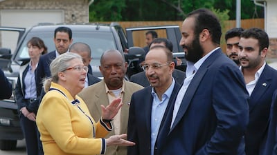 Habitat for Humanity Executive Director Allison Hay speaks to Saudi Crown Prince Mohammed bin Salman, as Houston Mayor Sylvester Turner stands by, near a Habitat for Humanity home in Houston. Steve Gonzales / AP Photo
