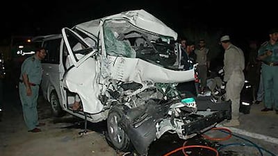 Traffic and rescue teams remove bodies of the passengers who died.