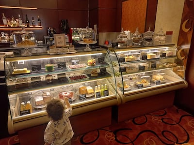 The youngest of our party chooses his cake at Cafe Mozart. Photo: Geraint Hacking for The National