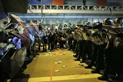 Riot police confront protesters in the Mongkok district of Hong Kong in 2014. Vincent Yu /AP