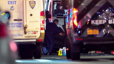 A police officer checks a vehicle near the scene of the incident. Reuters