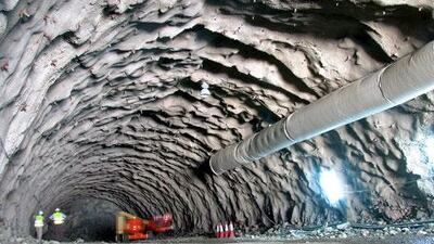 Halcrow contractors dig the Diftar Shis tunnel through the Hajar mountains, which is part of a road project that would connect Sharjah to the main port of Khor Fakkan.