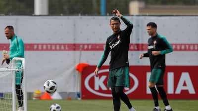 Cristiano Ronaldo, centre, and his teammates attend a training session in Kratovo, Moscow, Russia on June 12, 2018. Maxim Shemetov / Reuters