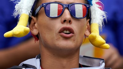 A French supporter cheers his team during the Rugby World Cup match between France and Argentina in Tokyo, Japan. France won the match. EPA
